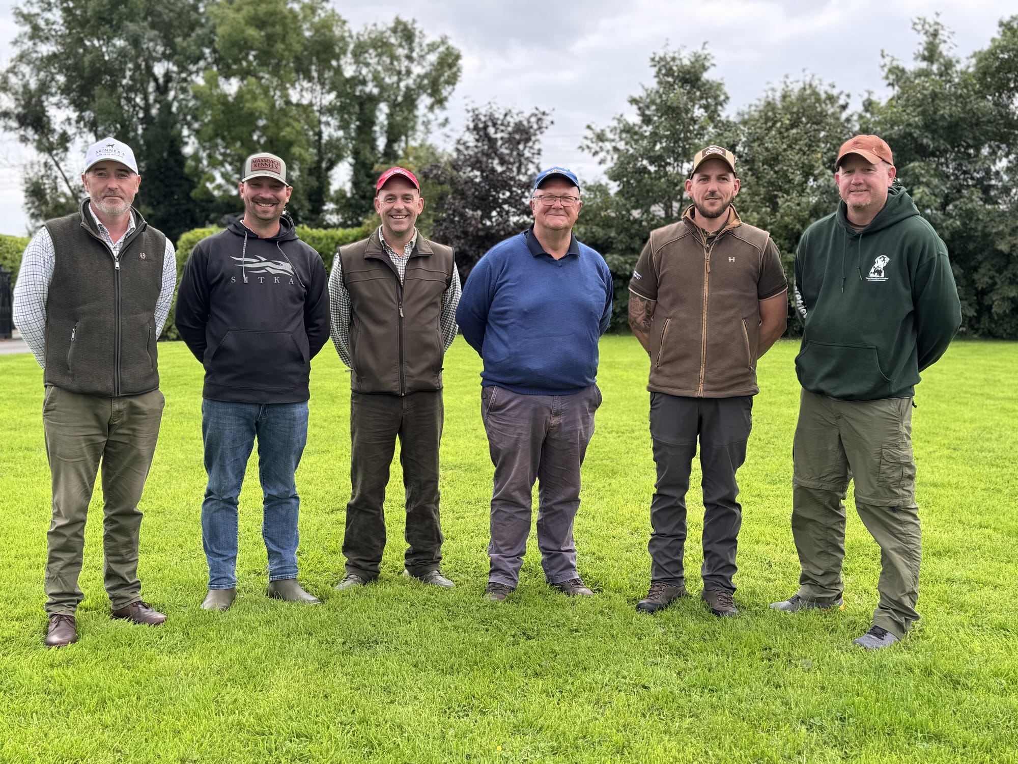 The GRS trainers standing together on the lawn at Oliver's
